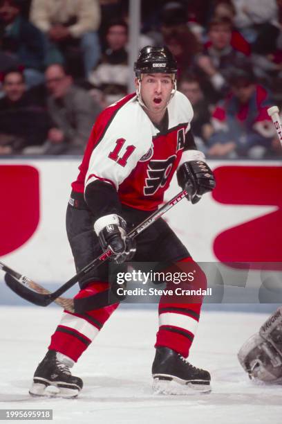 Philadelphia Flyers forward, Kevin Dineen , is parked in front of the Devil's net, looking for a pass during the game against the NJ Devils at the...