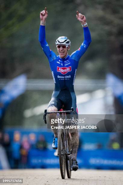 Belgian rider Niels Vandeputte celebrates as he crosses the finish line to win the Men's elite race of the Krawatencross cyclocross, the seventh...