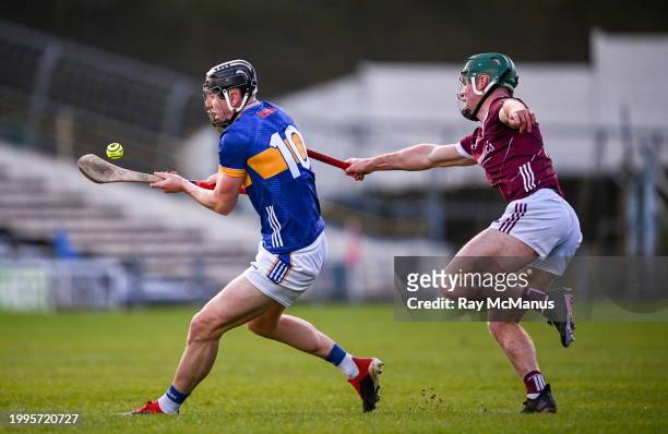 Tipperary , Ireland - 11 February 2024; Gearoid O'Connor of Tipperary is tackled by Gavin Lee of Galway during the Allianz Hurling League Division 1...