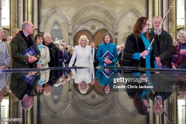 Queen Camilla takes a moment of reflection at The Salisbury font, designed by British water sculptor William Pye during a musical evening at...