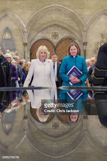 Queen Camilla takes a moment of reflection at The Salisbury font, designed by British water sculptor William Pye during a musical evening at...
