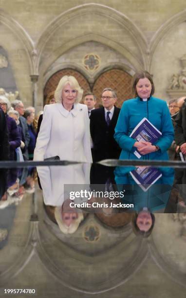 Queen Camilla takes a moment of reflection at The Salisbury font, designed by British water sculptor William Pye during a musical evening at...