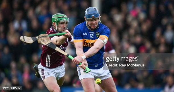 Tipperary , Ireland - 11 February 2024; Alan Tynan of Tipperary is tackled by Jack Grealish of Galway during the Allianz Hurling League Division 1...