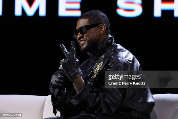 Usher speaks on stage during the Apple Music Super Bowl LVIII Halftime Show Press Conference at Mandalay Bay on February 8, 2024 in Las Vegas, NV.