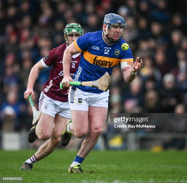 Tipperary , Ireland - 11 February 2024; Alan Tynan of Tipperary is tackled by Jack Grealish of Galway during the Allianz Hurling League Division 1...