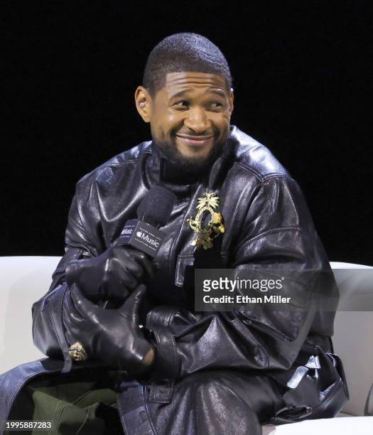 Usher speaks onstage during the Super Bowl LVIII Pregame & Apple Music Super Bowl LVIII Halftime Show press conference at the Mandalay Bay Convention...