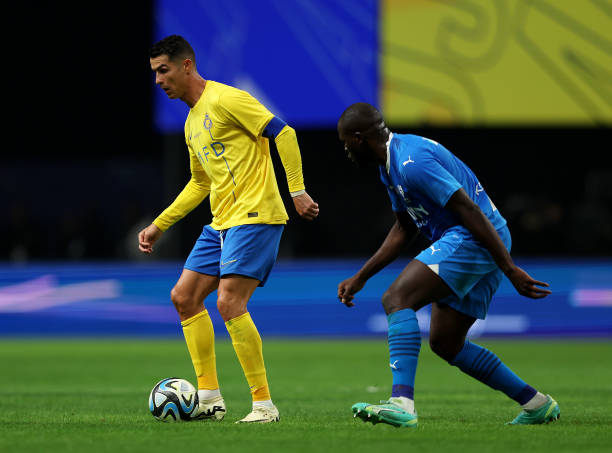 Cristiano Ronaldo of Al-Nassr controls the ball whilst under pressure from Kalidou Koulibaly of Al Hilal during the Riyadh Season Cup Final match...