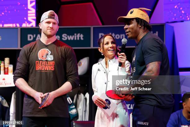 Dustin Hopkins, Kay Adams and Jamaal Williams attend the Second Annual P&G Battle of the Paddles at Super Bowl LVIIl presented by Procter & Gamble at...