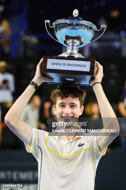 France's Ugo Humbert holds his trophy after winning the ATP Open 13 final tennis match on February 11, 2024 in Marseille, southern France.