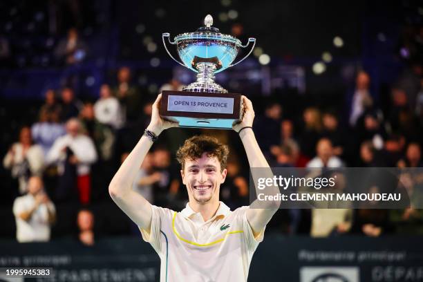 France's Ugo Humbert holds his trophy after winning the ATP Open 13 final tennis match on February 11, 2024 in Marseille, southern France.