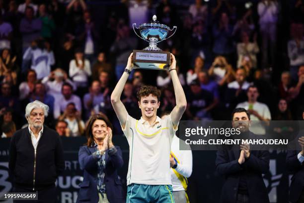 France's Ugo Humbert holds his trophy after winning the ATP Open 13 final tennis match on February 11, 2024 in Marseille, southern France.