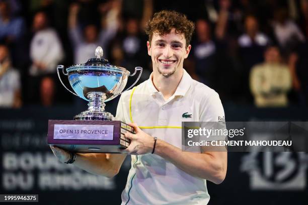 France's Ugo Humbert holds his trophy after winning the ATP Open 13 final tennis match on February 11, 2024 in Marseille, southern France.