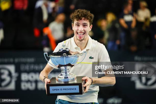 France's Ugo Humbert holds his trophy after winning the ATP Open 13 final tennis match on February 11, 2024 in Marseille, southern France.