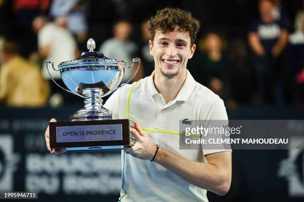 France's Ugo Humbert holds his trophy after winning the ATP Open 13 final tennis match on February 11, 2024 in Marseille, southern France.