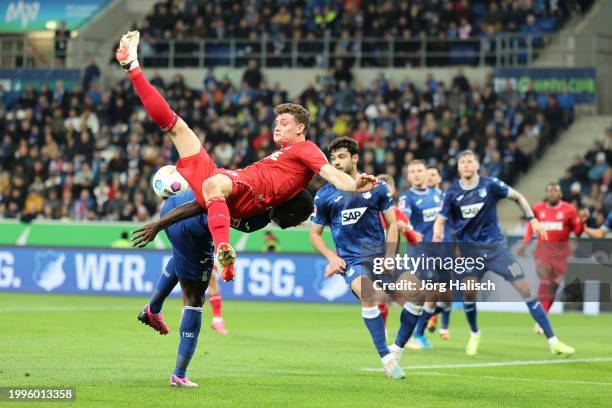 Ihlas Bebou of Hoffenheim and Eric Martel of Köln during the Bundesliga match between TSG Hoffenheim and 1. FC Köln at PreZero-Arena on February 11,...