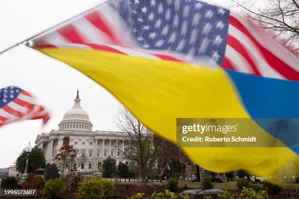 Ukraine sympathizers fly a Ukrainian flag outside as the Senate works through the weekend on a $95.3 billion foreign aid bill with assistance for...