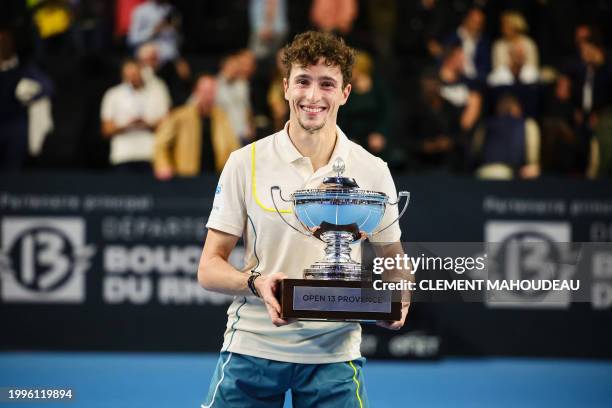 France's Ugo Humbert poses with his trophy after winning the ATP Open 13 final tennis match on February 11, 2024 in Marseille, southern France.