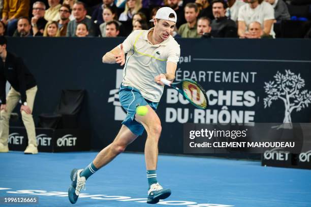 France's Ugo Humbert hits a return to Bulgaria's Grigor Dimitrov during their ATP Open 13 final tennis match on February 11, 2024 in Marseille,...