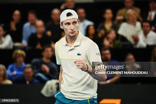 France's Ugo Humbert reatcs after a point against Bulgaria's Grigor Dimitrov during their ATP Open 13 final tennis match on February 11, 2024 in...