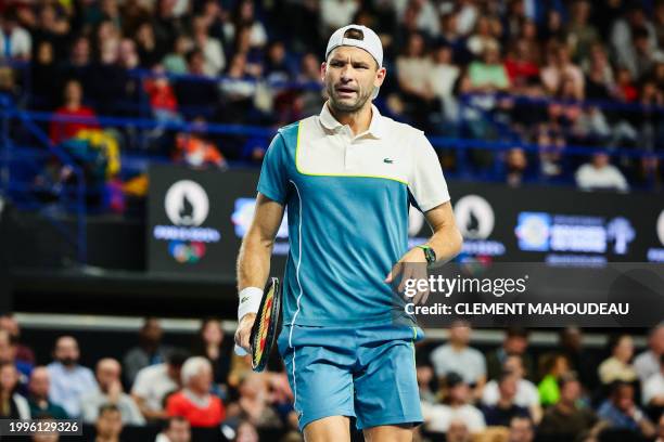 Bulgaria's Grigor Dimitrov reatcs after a point against France's Ugo Humbert during their ATP Open 13 final tennis match on February 11, 2024 in...