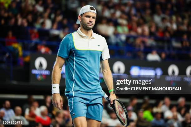 Bulgaria's Grigor Dimitrov reatcs after a point against France's Ugo Humbert during their ATP Open 13 final tennis match on February 11, 2024 in...