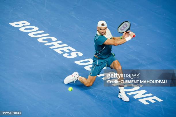 Bulgaria's Grigor Dimitrov hits a return to France's Ugo Humbert during their ATP Open 13 final tennis match on February 11, 2024 in Marseille,...