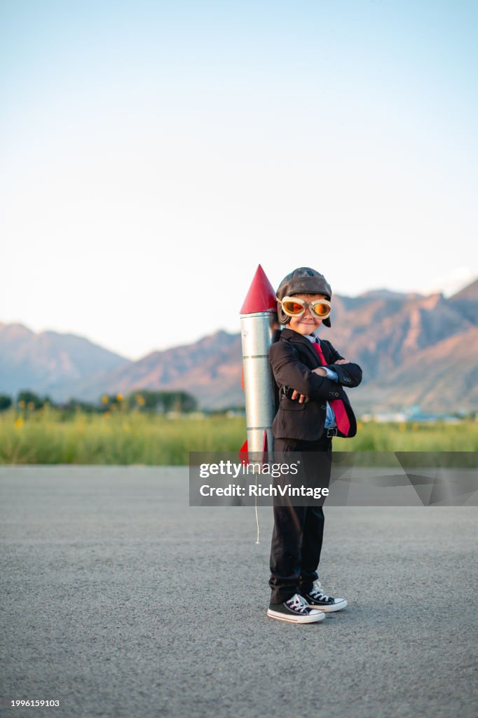 Young Boy Businessman Ready to Fly