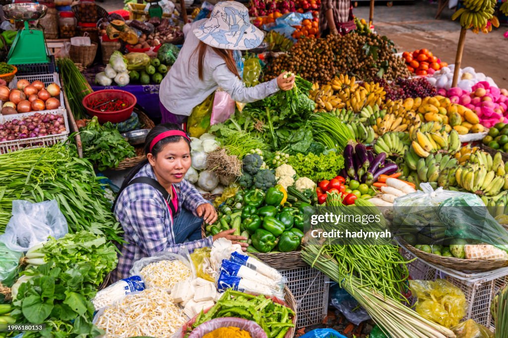 Cambodian women selling fresh fruits and vegetables, Cambodia