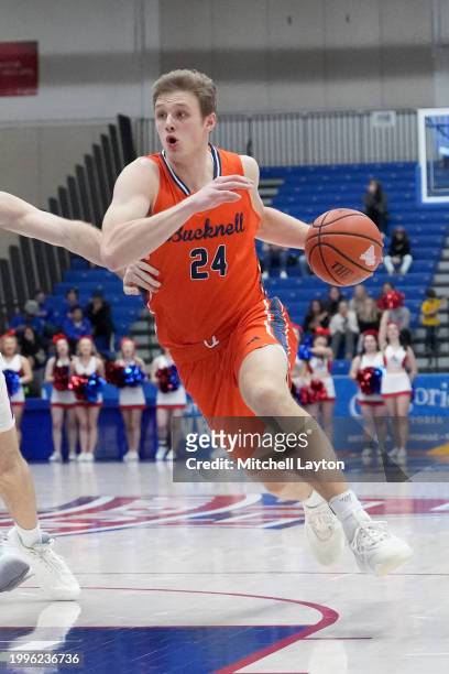 Jack Forrest of the Bucknell Bison drives to the basket during a college basketball game against the American University Eagles at Bender Arena on...
