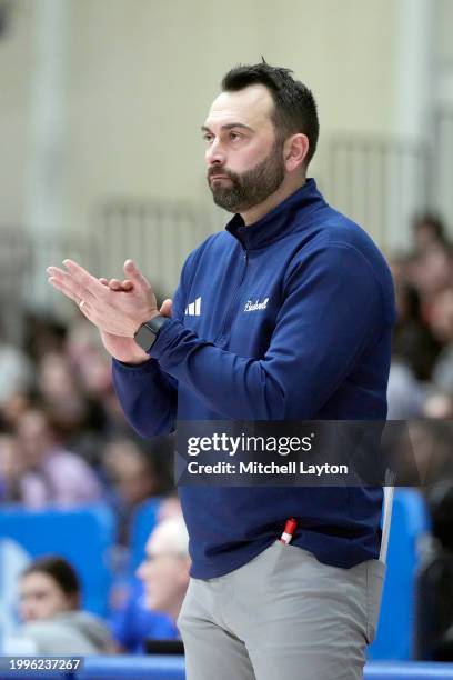 Head coach John Griffin III of the Bucknell Bison looks on during a college basketball game against the American University Eagles at Bender Arena on...