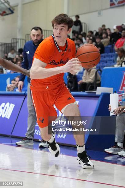 Ian Motta of the Bucknell Bison dribbles the ball during a college basketball game against the American University Eagles at Bender Arena on February...