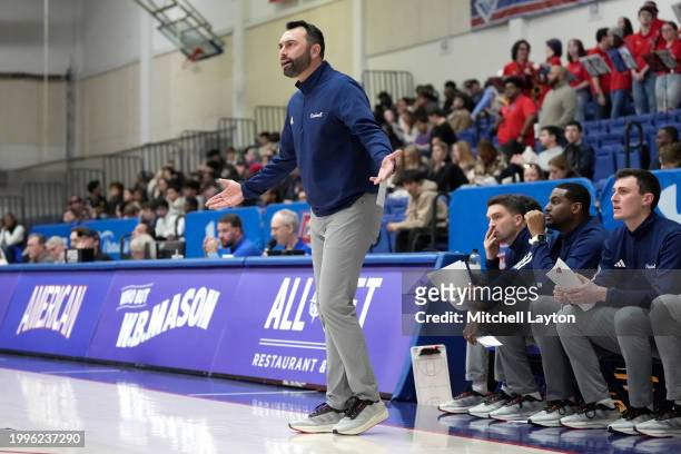 Head coach John Griffin III of the Bucknell Bison reacts to a call during a college basketball game against the American University Eagles at Bender...