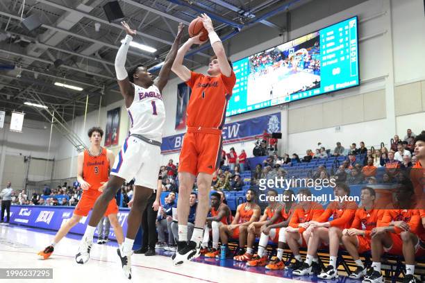 Ian Motta of the Bucknell Bison takes a shot over Elijah Stephens of the American University Eagles during a college basketball game at Bender Arena...