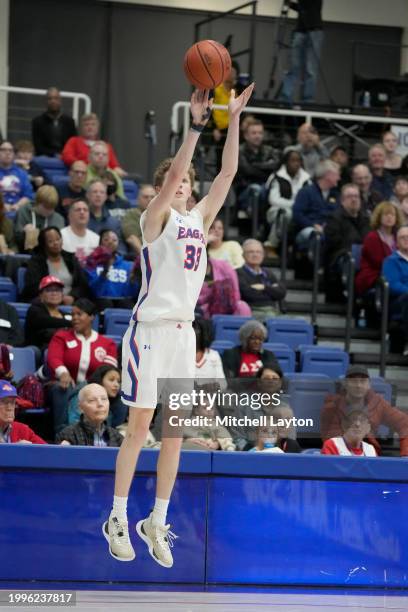 Matt Mayock of the American University Eagles takes a jump shot during a college basketball game against the Bucknell Bison at Bender Arena on...