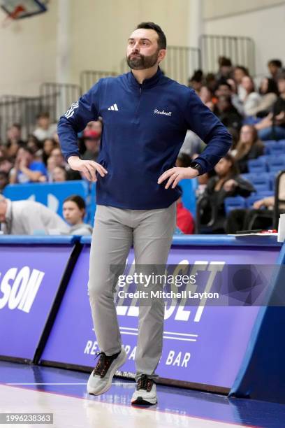 Head coach John Griffin III of the Bucknell Bison looks on during a college basketball game against the American University Eagles at Bender Arena on...