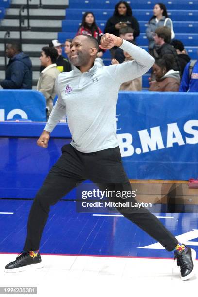 Head coach Duane Simpkins of the American University Eagles celebrates a win after a college basketball game against Bucknell Bison at Bender Arena...