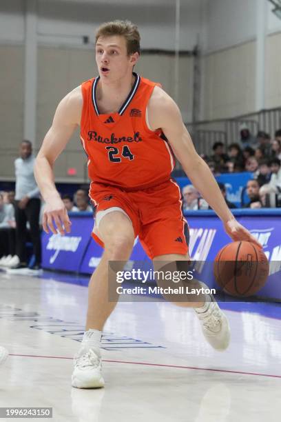 Jack Forrest of the Bucknell Bison dribbles the ball during a college basketball game against the American University Eagles at Bender Arena on...