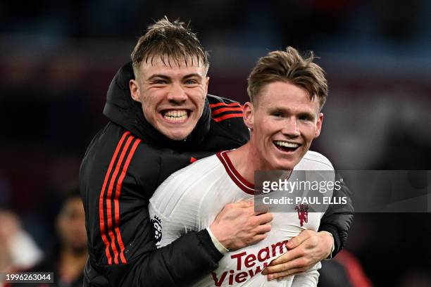 Manchester United's Scottish midfielder Scott McTominay and Manchester United's Danish striker Rasmus Hojlund celebrate at the end of the English...