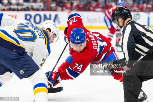 Oskar Sundqvist of the St. Louis Blues faces off Brandon Gignac of the Montreal Canadiens during the first period of the NHL regular season game...