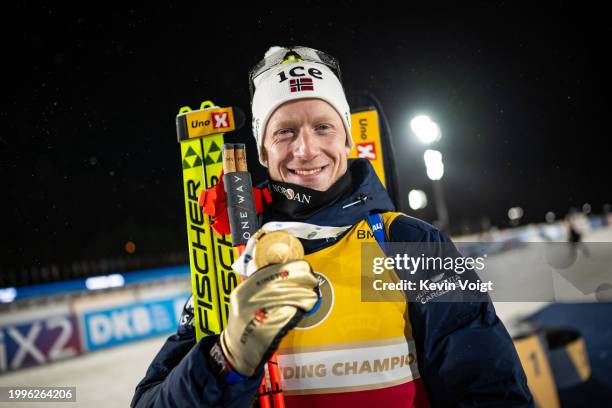 Johannes Thingnes Boe of Norway looks on with the gold medal after the medal ceremony for the Men 12.5 km Pursuit at the IBU World Championships...