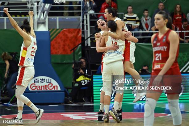 Spain's players celebrate their victory over Hungary after the 2024 FIBA Women's Olympic qualifying tournament basketball match between Spain and...