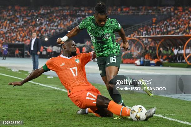 Ivory Coast's defender Serge Aurier tackles Nigeria's forward Ademola Lookman during the Africa Cup of Nations 2024 final football match between...