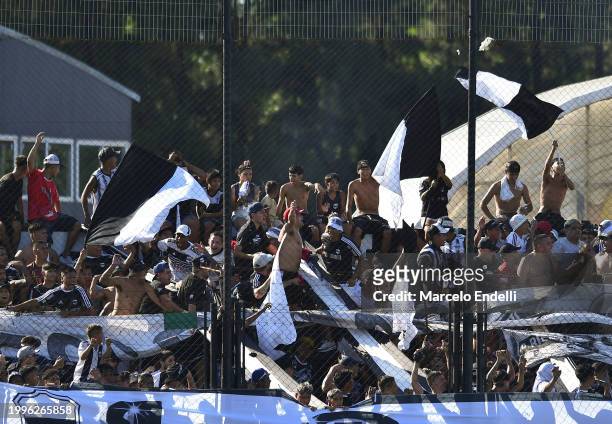 Fans of Deportivo Riestra cheer for their team during a Copa de la Liga 2024 group A match between Deportivo Riestra and River Plate at Estadio...
