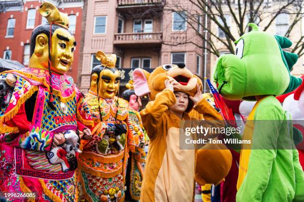 Participant representing a rat, one of the 12 animals of Chinese zodiac, prepares for the Chinese Lunar New Year Parade in the Chinatown neighborhood...