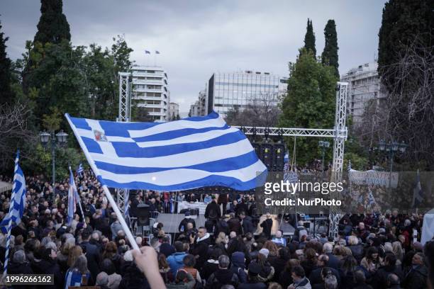 People are holding Greek flags and religious icons during a gathering of members of the religious conservative party ''Niki,'' members of...