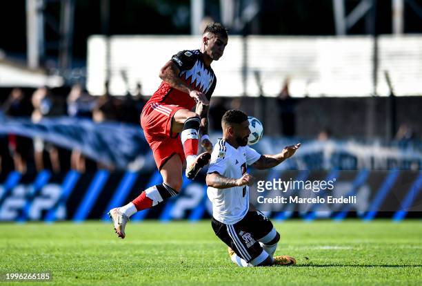 Leandro Gonzalez Pirez of River Plate competes for the ball with Walter Acuna of Deportivo Riestra during a Copa de la Liga 2024 group A match...