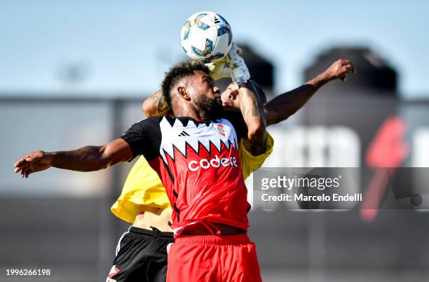 Miguel Borja of River Plate competes for the ball with Ignacio Arce of Deportivo Riestra during a Copa de la Liga 2024 group A match between...