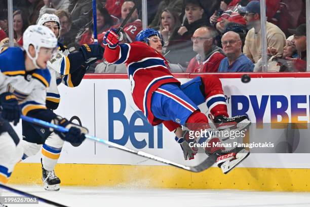 Michael Pezzetta of the Montreal Canadiens slips as he skates after the puck during the third period against the St. Louis Blues at the Bell Centre...