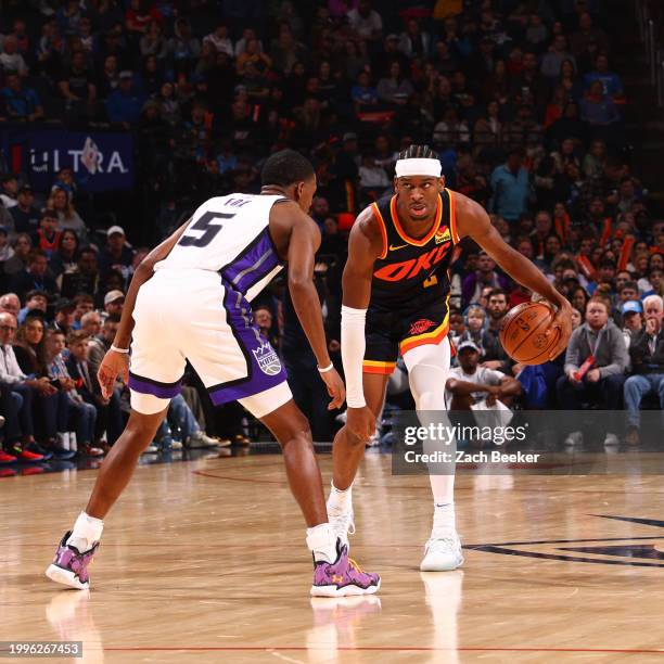 Shai Gilgeous-Alexander of the Oklahoma City Thunder dribbles the ball during the game against the Sacramento Kings on February 11, 2024 at Paycom...