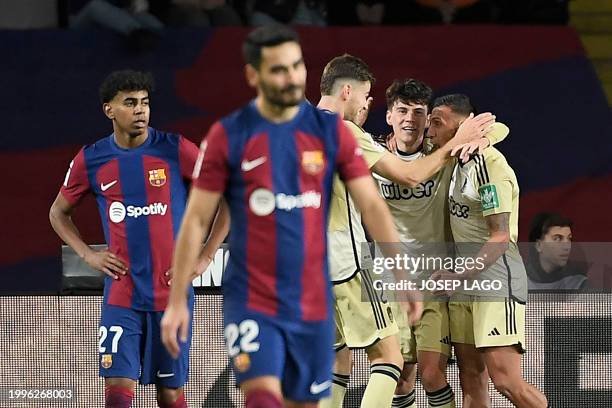 Granada players celebrate the equalizing goal scored by Granada's Uruguayan forward Facundo Pellistri during the Spanish league football match...